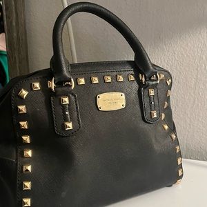 Michael Kors: Black Studded Hand Purse with removable shoulder strap